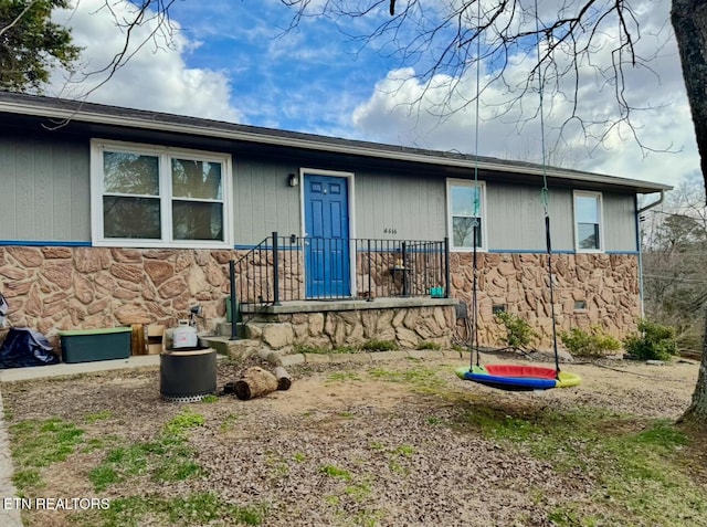 view of front of home featuring stone siding