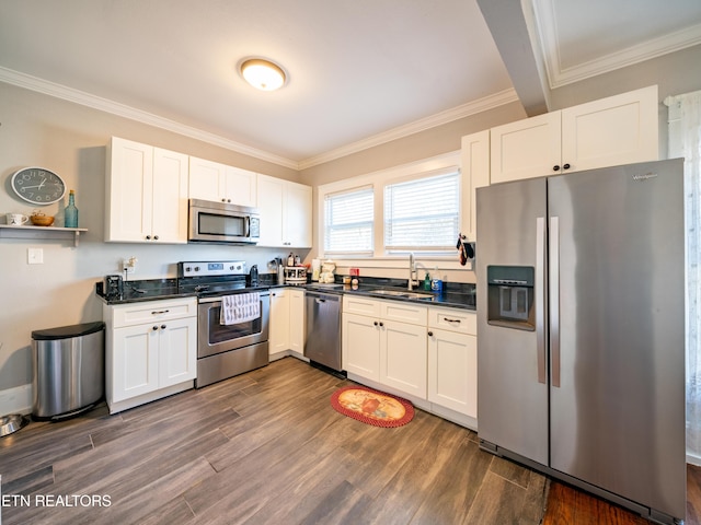 kitchen with white cabinetry, sink, dark wood-type flooring, and stainless steel appliances