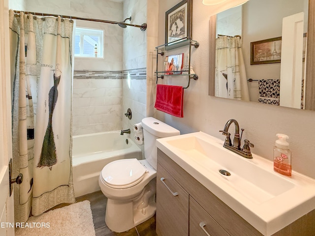 full bathroom with vanity, toilet, and shower / bath combo with shower curtain