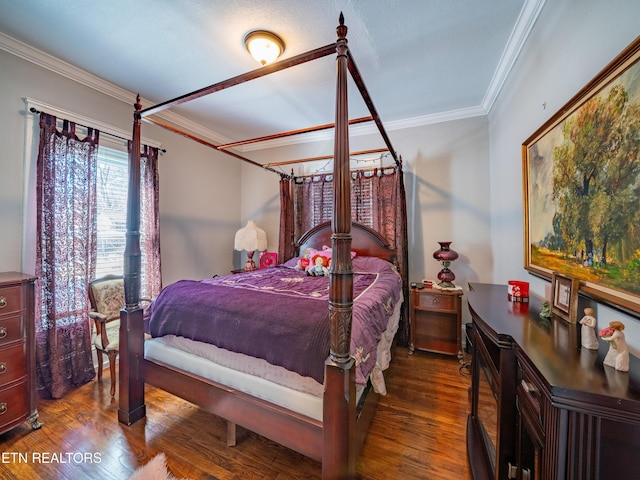 bedroom featuring crown molding and dark hardwood / wood-style floors