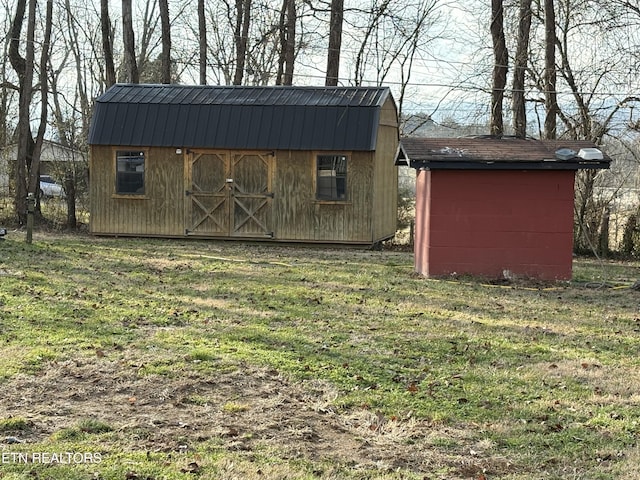 view of outdoor structure with a lawn