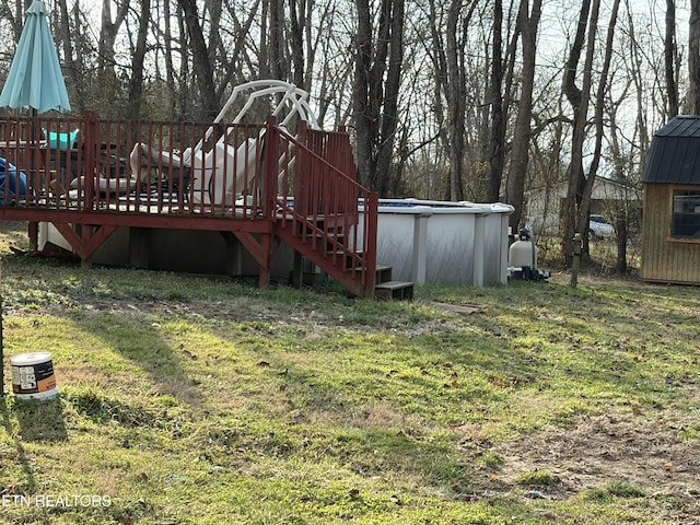 view of yard with a pool side deck