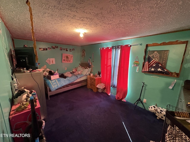 bedroom featuring a textured ceiling and carpet flooring