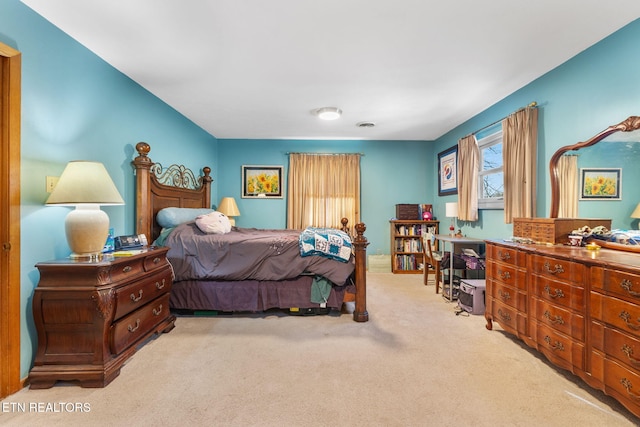 bedroom featuring light colored carpet