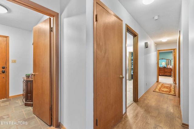 corridor featuring light wood-type flooring