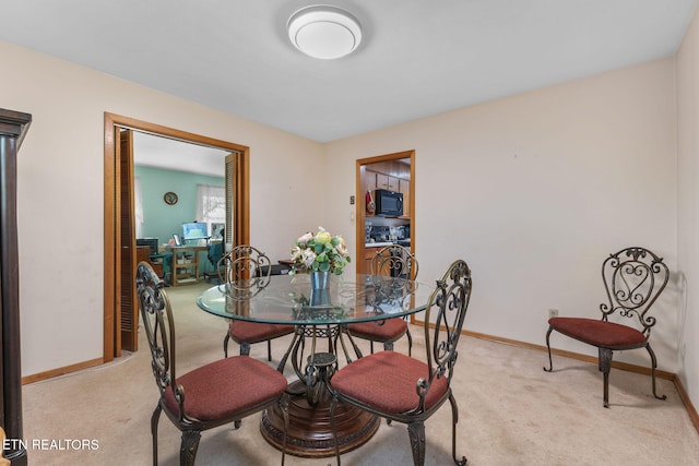 view of carpeted dining space