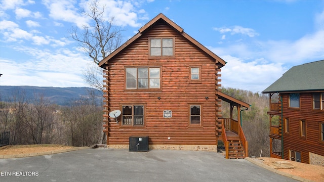 view of property exterior featuring a mountain view