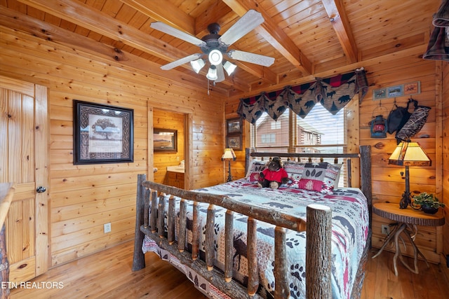 bedroom featuring wood ceiling, beamed ceiling, and hardwood / wood-style flooring