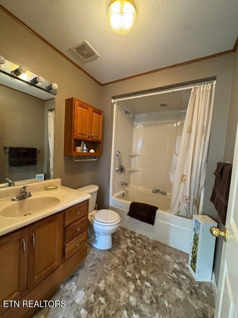 full bathroom featuring toilet, shower / tub combo, a textured ceiling, ornamental molding, and vanity