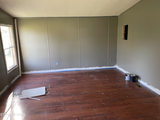 4589 Mount Carmel Rd, Camden, TN 38320 - unfurnished room with baseboards, a textured ceiling, and wood finished floors