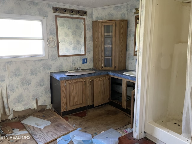 4589 Mount Carmel Rd, Camden, TN 38320 - full bath with wallpapered walls, a sink, double vanity, and a shower stall