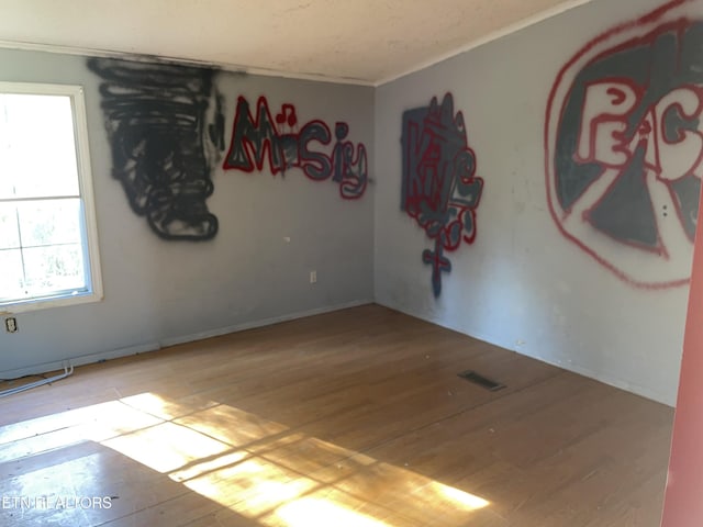 4589 Mount Carmel Rd, Camden, TN 38320 - empty room featuring visible vents and light wood-type flooring