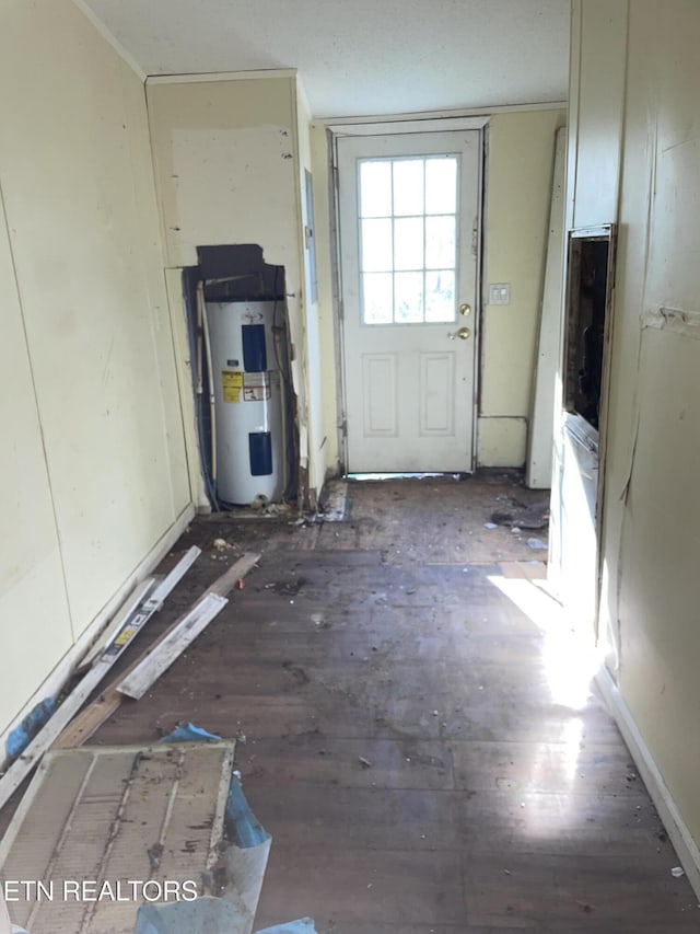 4589 Mount Carmel Rd, Camden, TN 38320 - doorway to outside with water heater, wood finished floors, and ornamental molding