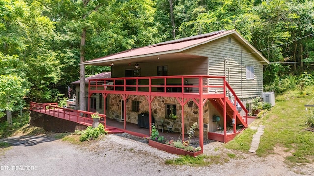 1731 Vonore Rd, Loudon, TN 37774 - chalet / cabin with a deck, a view of trees, stone siding, and a patio area