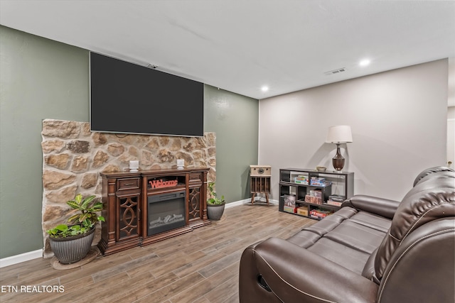 1731 Vonore Rd, Loudon, TN 37774 - living room with wood finished floors, baseboards, recessed lighting, and a glass covered fireplace