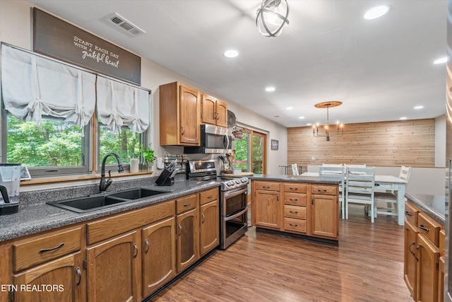 1731 Vonore Rd, Loudon, TN 37774 - kitchen with stainless steel appliances, a sink, dark countertops, a peninsula, and recessed lighting