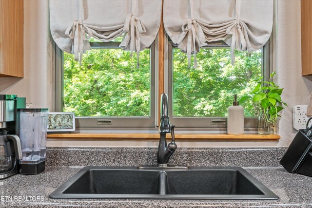 1731 Vonore Rd, Loudon, TN 37774 - kitchen view of a sink, dark countertops, and a textured wall