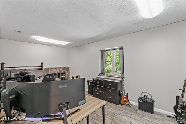 1731 Vonore Rd, Loudon, TN 37774 - office area featuring a textured ceiling, wood finish floors, and baseboards