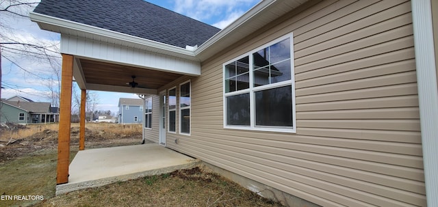 view of home's exterior with a patio area and ceiling fan