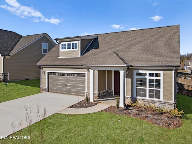 view of front of property with a shingled roof, an attached garage, stone siding, driveway, and a front lawn