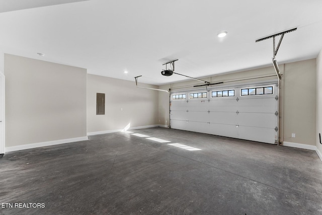 garage featuring recessed lighting, electric panel, baseboards, and a garage door opener