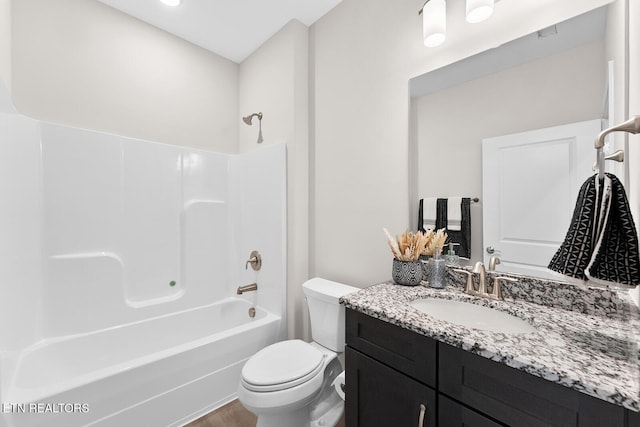 bathroom with shower / bath combination, toilet, and vanity