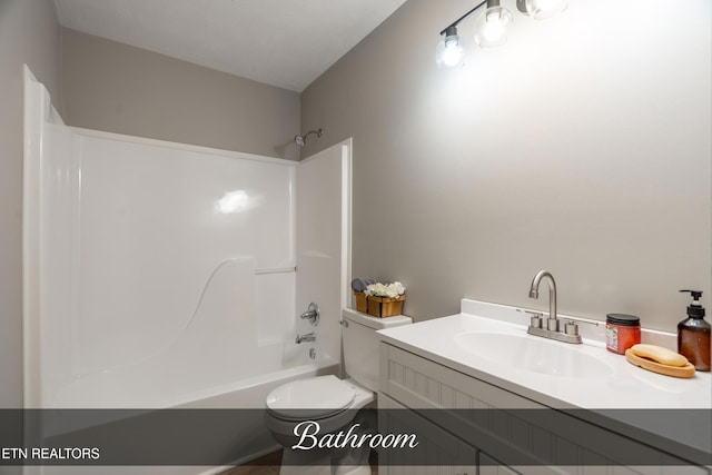 full bathroom with toilet, vanity, and shower / washtub combination