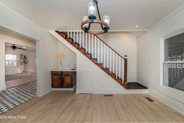 stairway with hardwood / wood-style flooring