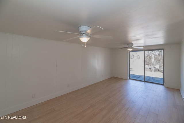 unfurnished room with light hardwood / wood-style floors