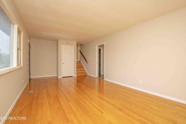 spare room with light wood-type flooring