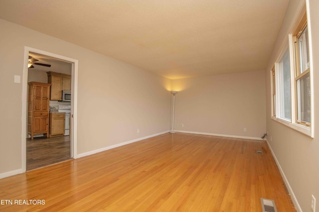 unfurnished room with light hardwood / wood-style floors