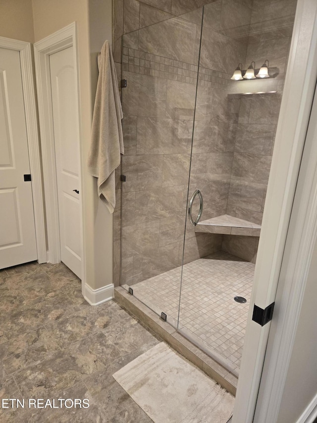 bathroom featuring an enclosed shower