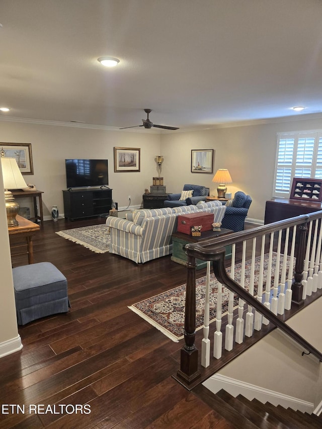 living room with ornamental molding, hardwood / wood-style floors, and ceiling fan