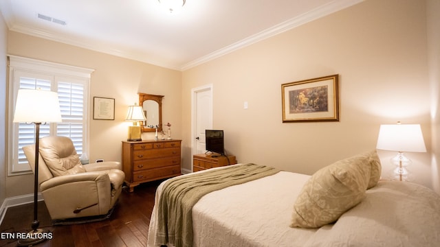 bedroom with dark wood-type flooring and ornamental molding