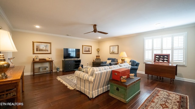 living room with crown molding, dark wood-type flooring, and ceiling fan