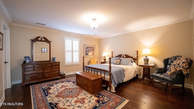 bedroom with crown molding and dark hardwood / wood-style floors