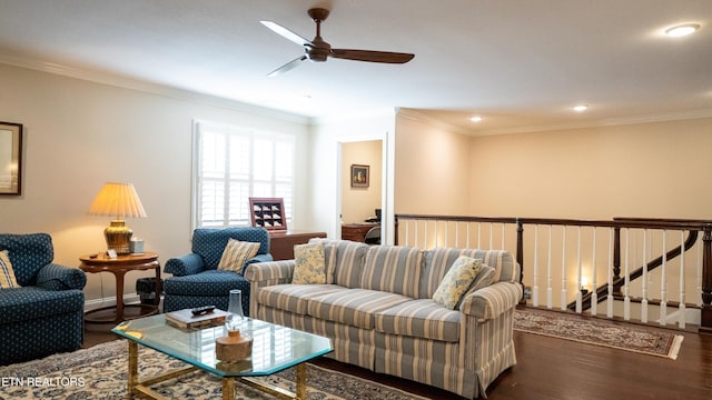 living room featuring ceiling fan, ornamental molding, and dark hardwood / wood-style floors