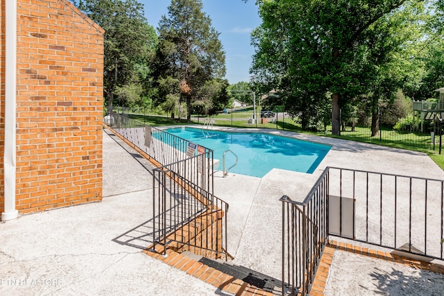 view of pool featuring a patio area