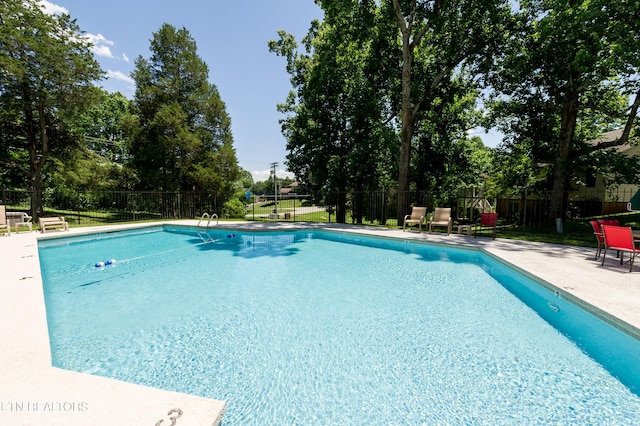 view of swimming pool with a patio area