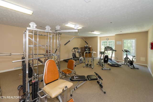 workout area with a textured ceiling