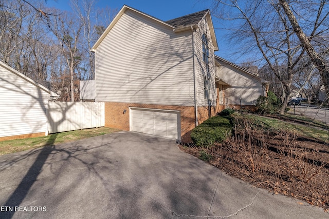 view of side of property with a garage