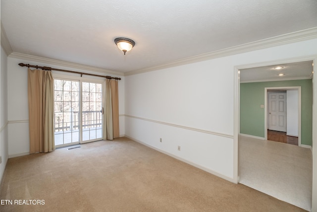 unfurnished room featuring crown molding, a textured ceiling, and carpet flooring