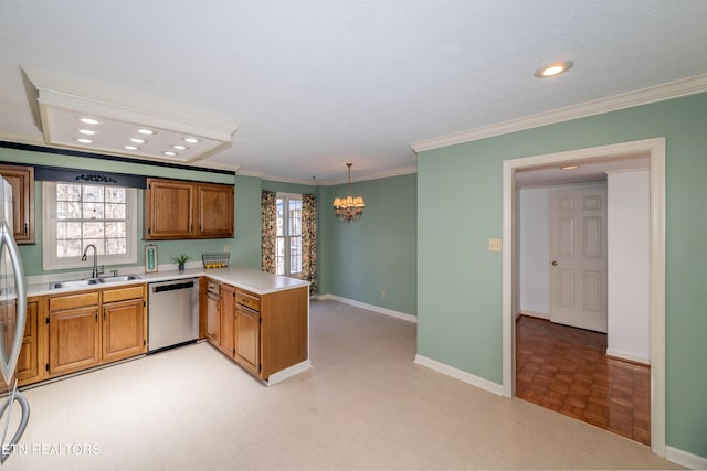 kitchen with pendant lighting, sink, stainless steel dishwasher, kitchen peninsula, and crown molding