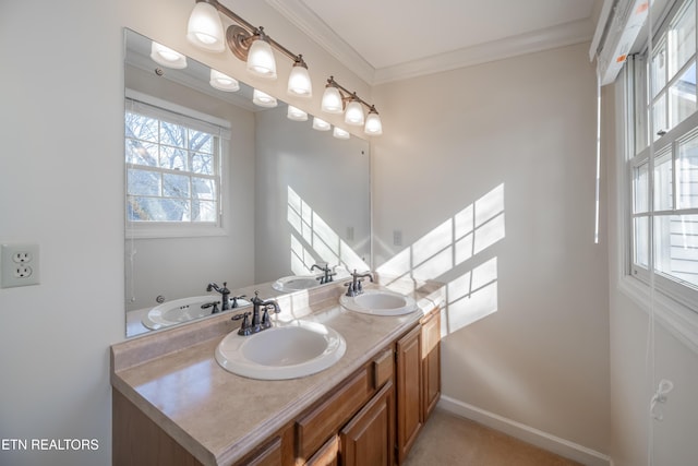 bathroom with ornamental molding and vanity