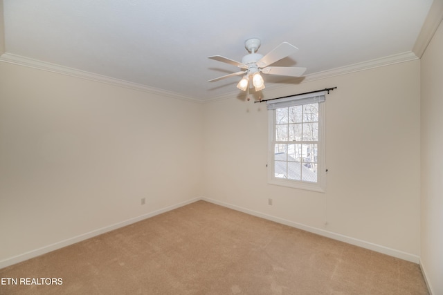 empty room with crown molding, ceiling fan, and light carpet