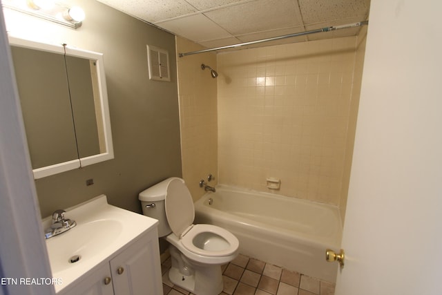 full bathroom featuring vanity, toilet, tile patterned floors, and tiled shower / bath