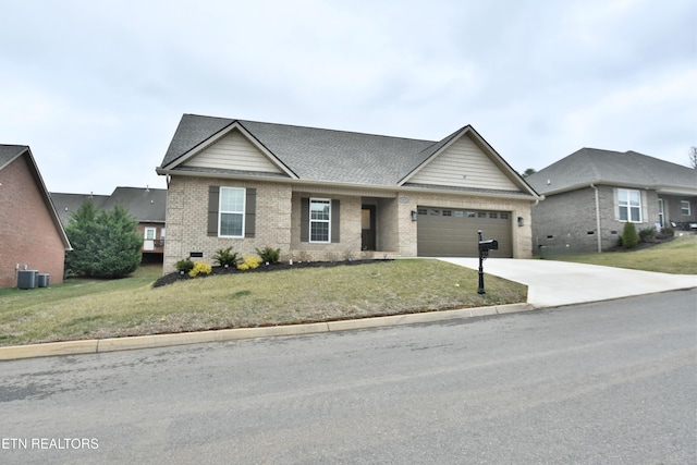 view of front facade featuring a garage, central AC, and a front lawn