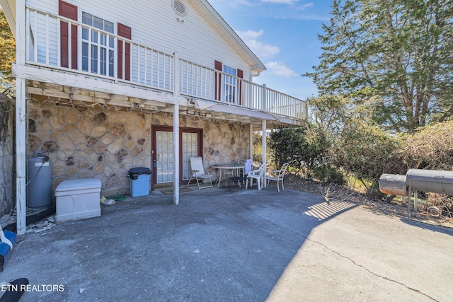 view of patio / terrace featuring outdoor dining space, a deck, and area for grilling