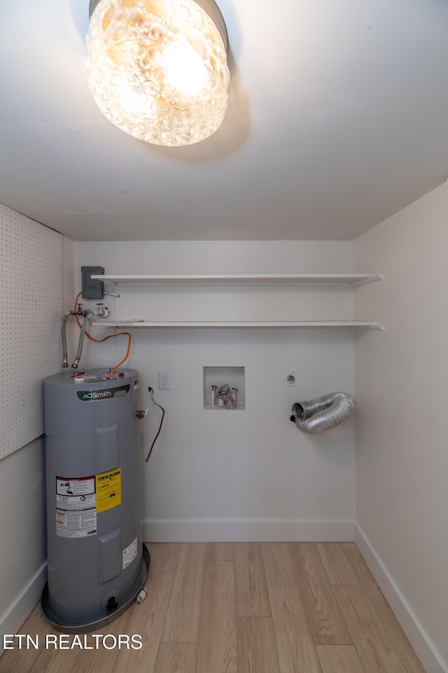 utility room featuring electric water heater