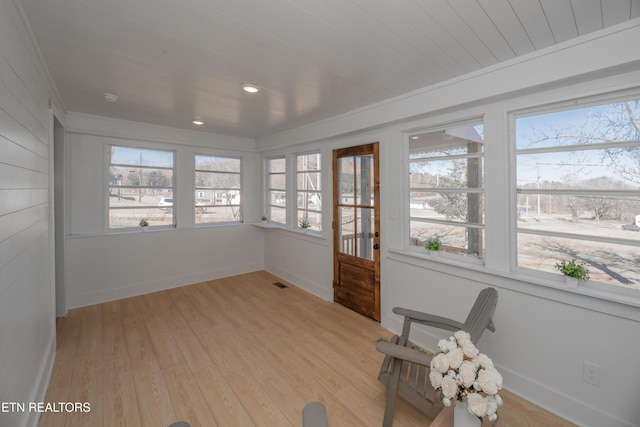 unfurnished sunroom featuring plenty of natural light